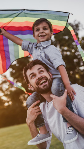 pain free man playing with child